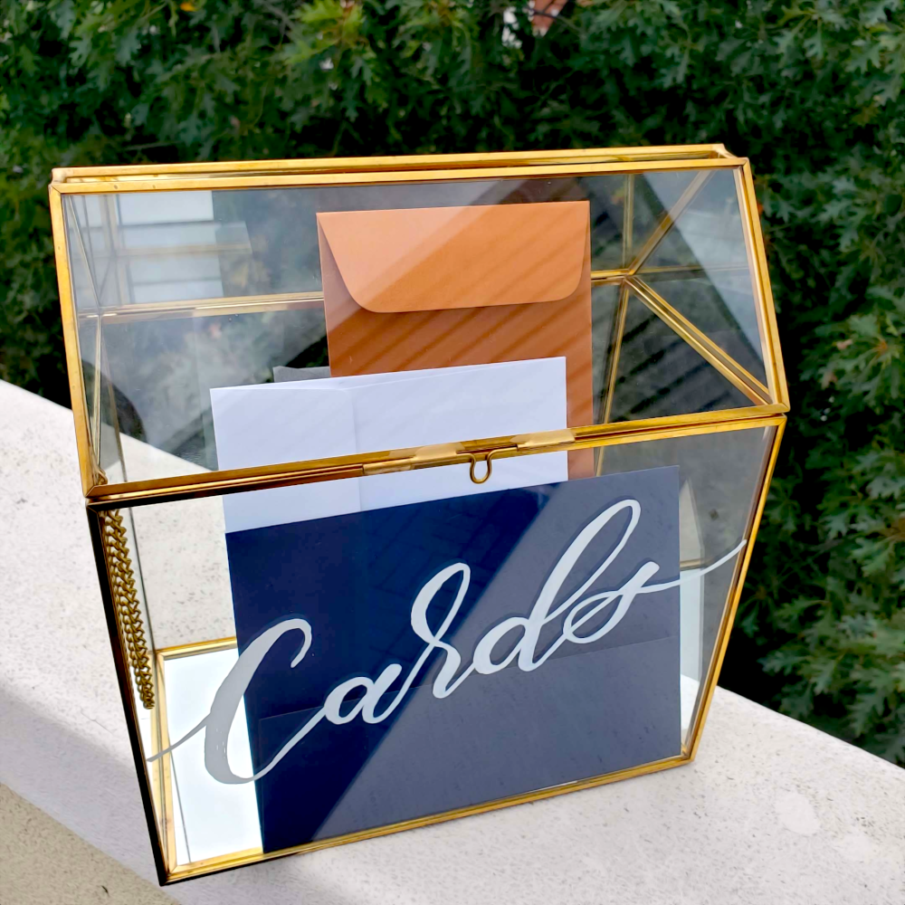 glass box of cards, with calligraphy